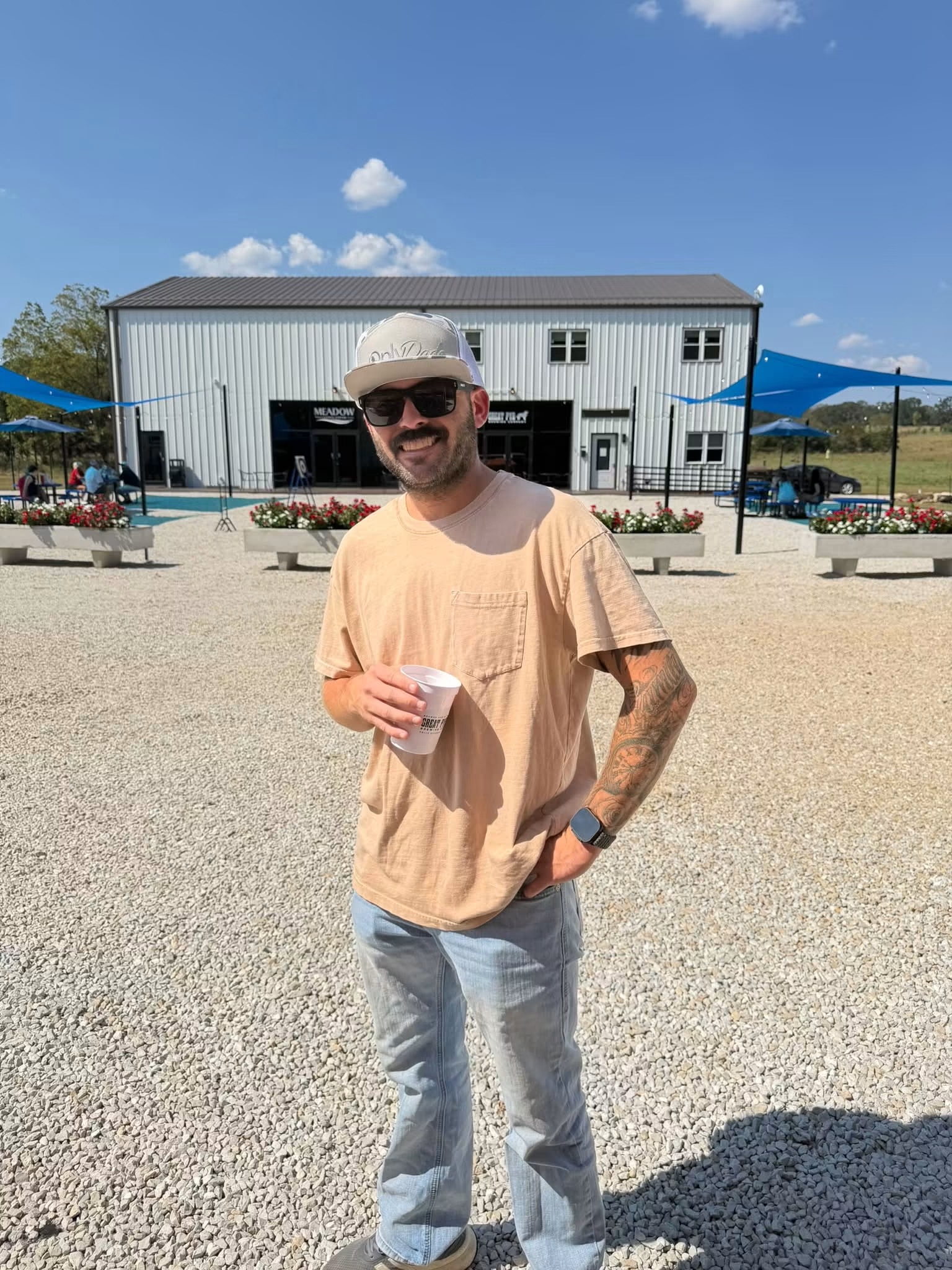 OnlyDads founder wearing an OnlyDads hat outdoors